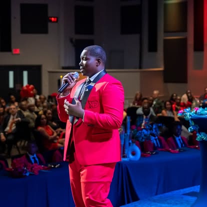 Kut Different mentees in red blazers laughing together backstage at the Summer Gala.